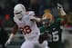 WACO, TX - DECEMBER 07: Lache Seastrunk #25 of the Baylor Bears runs the ball past Cedric Reed #88 of the Texas Longhorns at Floyd Casey Stadium on December 7, 2013 in Waco, Texas. (Photo by Ronald Martinez/Getty Images)