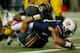 ATLANTA, GA - DECEMBER 07: Running back Tre Mason #21 of the Auburn Tigers dives for a touchdown over Matt White #17 and Kentrell Brothers #10 of the Missouri Tigers in the second quarter during the SEC Championship Game at Georgia Dome on December 7, 20