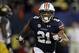 Dec 7, 2013; Atlanta, GA, USA; Auburn Tigers running back Tre Mason (21) celebrates after a touchdown against the Missouri Tigers during the fourth quarter of the 2013 SEC Championship game at Georgia Dome. Auburn won 59-42. Mandatory Credit: Brett Davis-