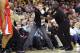 Dec 7, 2013; Cleveland, OH, USA; Security grabs a fan who walked on to the court in the second quarter during a game between the Cleveland Cavaliers and the Los Angeles Clippers at Quicken Loans Arena. Mandatory Credit: David Richard-USA TODAY Sports