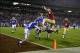 Dec 7, 2013; Charlotte, NC, USA; Florida State Seminoles quarterback Jameis Winston (5) scores a touchdown as Duke Blue Devils cornerback Bryon Fields (14) and linebacker David Helton (47) and defensive end Kenny Anunike (84) and safety Dwayne Norman (40)