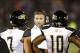 Aug 29, 2013; East Hartford, CT, USA; Towson Tigers head coach Rob Ambrose speaks to quarterback Peter Athens (7) and wide receiver Spencer Wilkins (10) during the first half of a game against the Connecticut Huskies at Rentschler Field. Mandatory Credit: