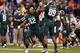INDIANAPOLIS, IN - DECEMBER 07: Denzel Drone #42 of the Michigan State Spartans and teammate Shilique Calhoun #89 celebrate after a defensive stop in the last minutes of the Big Ten Conference Championship game against Ohio State Buckeyes at Lucas Oil St