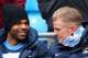 Hart looks positively cozy in that jacket and scarf.