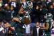 INDIANAPOLIS, IN - DECEMBER 07: Jeremy Langford #33 of the Michigan State Spartans is lifted by teammate Fou Fonoti #51 after scoring the game winning touchdown in the fourth quarterof the Big Ten Conference Championship game against the Ohio State Bucke