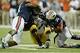 Dec 7, 2013; Atlanta, GA, USA; Missouri Tigers quarterback James Franklin (1) is brought down by Auburn Tigers defensive end Dee Ford (30) and defensive end Elijah Daniel (97) during the fourth quarter of the 2013 SEC Championship game at Georgia Dome. Ma