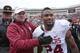 STILLWATER, OK - DECEMBER 7: Head coach Bob Stoops congratulates running back Brennan Clay #24 of the Oklahoma Sooners after the game against the Oklahoma State Cowboys December 7, 2013 at Boone Pickens Stadium in Stillwater, Oklahoma. Oklahoma defeate