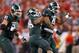 INDIANAPOLIS, IN - DECEMBER 07: Tyler Hoover #91, Denicos Allen #28 and Ed Davis #43 of the Michigan State Spartans celebrate against Ohio State during the Big 10 Conference Championship Game at Lucas Oil Stadium on December 7, 2013 in Indianapolis, India