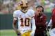 Sep 15, 2013; Green Bay, WI, USA; Washington Redskins quarterback Robert Griffin III (10) and head coach Mike Shanahan walk on the sidelines during the game against the Green Bay Packers in the third quarter at Lambeau Field. Mandatory Credit: Benny Sieu