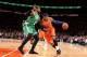 NEW YORK, NY - DECEMBER 8: Carmelo Anthony #7 of the New York Knicks drives against Jared Sullinger #7 of the Boston Celtics during a game at Madison Square Garden in New York City on December 8, 2013. NOTE TO USER: User expressly acknowledges and agrees