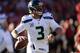 SAN FRANCISCO, CA - DECEMBER 08: Russell Wilson #3 of the Seattle Seahawks rolls out to pass against the San Francisco 49ers during the first quarter at Candlestick Park on December 8, 2013 in San Francisco, California. (Photo by Thearon W. Henderson/Ge