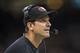 NEW ORLEANS, LA - NOVEMBER 17: Head Coach Jim Harbaugh of the San Francisco 49ers watches a replay on the scoreboard during a game against the New Orleans Saints at Mercedes-Benz Superdome on November 17, 2013 in New Orleans, Louisiana. The Saints defe