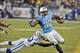 Nov 14, 2013; Nashville, TN, USA; Tennessee Titans tight end Delanie Walker (82) rushes past Indianapolis Colts cornerback Vontae Davis (23) during the second half at LP Field. Indianapolis won 30-27. Mandatory Credit: Jim Brown-USA TODAY Sports
