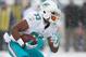 PITTSBURGH, PA - DECEMBER 08: Daniel Thomas #33 of the Miami Dolphins looks for room to run against the Pittsburgh Steelers in the second quarter at Heinz Field on December 8, 2013 in Pittsburgh, Pennsylvania. (Photo by Gregory Shamus/Getty Images)
