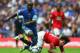 Diarra takes on Carlos Tevez in his Portsmouth days