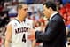 Dec 3, 2013; Tucson, AZ, USA; Arizona Wildcats guard T.J. McConnell (4) and head coach Sean Miller talk strategy during the second half against the Texas Tech Red Raiders at McKale Center. Arizona defeated Texas Tech 79-58. Mandatory Credit: Casey Sapio-U