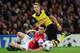 LONDON, ENGLAND - OCTOBER 22: Marco Reus of Borussia Dortmund and Laurent Koscielny of Arsenal in action during the UEFA Champions League Group F match between Arsenal and Borussia Dortmund at Emirates Stadium on October 22, 2013 in London, England. (Ph