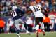 FOXBORO, MA - DECEMBER 08: Josh Gordon #12 of the Cleveland Browns stiff arms Aqib Talib #31 of the New England Patriots on his way to the endzone in the second half during the game at Gillette Stadium on December 8, 2013 in Foxboro, Massachusetts. (Phot