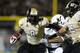 ORLANDO, FL - NOVEMBER 29: Storm Johnson #8 of the Central Florida Knights runs with the ball against the South Florida Bulls during the first half of the game at Bright House Networks Stadium on November 29, 2013 in Orlando, Florida. (Photo by Joe Robbi