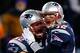 FOXBORO, MA - DECEMBER 08: Tom Brady #12 celebrates with teammate Ryan Wendell #62 of the New England Patriots following a touchdown late in the fourth quarter against the Cleveland Browns during the game at Gillette Stadium on December 8, 2013 in Foxboro
