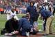 FOXBORO, MA - DECEMBER 8: Bill Belichick of the New England Patriots watches as Rob Gronkowski #87 is treated for injury in the 3rd quarter against the Cleveland Browns at Gillette Stadium on December 8, 2013 in Foxboro, Massachusetts. (Photo by Jim Rogas