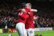 MANCHESTER, ENGLAND - NOVEMBER 28: Robin van Persie of Manchester United (L) celebrates with Wayne Rooney of Manchester United as he scores their first goal during the Barclays Premier League match between Manchester United and West Ham United at Old Tra
