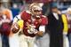 Dec 7, 2013; Charlotte, NC, USA; Florida State Seminoles quarterback Jameis Winston (5) runs the ball during the first quarter against the Duke Blue Devils at Bank of America Stadium. Mandatory Credit: Jeremy Brevard-USA TODAY Sports