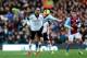 LONDON, ENGLAND - DECEMBER 08: Dimitar Berbatov of Fulham collides with Chris Herd of Aston Villa during the Barclays Premier League match between Fulham and Aston Villa at Craven Cottage on December 8, 2013 in London, England. (Photo by Paul Gilham/Get