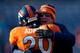 DENVER, CO - DECEMBER 8: Head Coach John Fox of the Denver Broncos hugs safety Mike Adams #20 of the Denver Broncos before a game against the Tennessee Titans at Sports Authority Field on December 8, 2013 in Denver, Colorado. (Photo by Justin Edmonds/Get