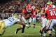 ATLANTA, GA - NOVEMBER 30: Todd Gurley #3 of the Georgia Bulldogs carries the ball for a first overtime touchdown against the Georgia Tech Yellow Jackets at Bobby Dodd Stadium on November 30, 2013 in Atlanta, Georgia. (Photo by Scott Cunningham/Getty Imag