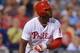 PHILADELPHIA, PA - AUGUST 20: Domonic Brown #9 of the Philadelphia Phillies hits a one-run sacrifice fly in the third inning against the Colorado Rockies at Citizens Bank Park on August 20, 2013 in Philadelphia, Pennsylvania. (Photo by Drew Hallowell/Gett