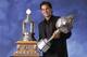 TORONTO, CANADA - JUNE 20: Jose Theodore of the Montreal Canadiens poses for a studio portrait with the Hart Memorial Trophy, awarded to the 'Most Valuable Player', and the Vezina Trophy, awarded to the 'Outstanding Goaltender', during the NHL Awards in
