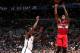 BROOKLYN, NY - APRIL 15: Cartier Martin #20 of the Washington Wizards shoots against Tyshawn Taylor #41 of the Brooklyn Nets on April 15, 2013 at the Barclays Center in the Brooklyn borough of New York City. NOTE TO USER: User expressly acknowledges and