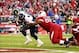 Dec 8, 2013; Phoenix, AZ, USA; St. Louis Rams running back Zac Stacy (30) scores a touchdown in the fourth quarter under pressure from Arizona Cardinals defensive tackle Dan Williams at University of Phoenix Stadium. The Cardinals defeated the Rams 30-10.