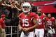 GLENDALE, AZ - OCTOBER 27: Wide receiver Michael Floyd #15 of the Arizona Cardinals leads John Abraham #55 and Rashad Johnson #26 onto the field before the NFL game against the Atlanta Falcons at the University of Phoenix Stadium on October 27, 2013 in G