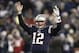 Dec 8, 2013; Foxborough, MA, USA; New England Patriots quarterback Tom Brady (12) signals for a touchdown during the fourth quarter of New England's 27-26 win over the Cleveland Browns at Gillette Stadium. Mandatory Credit: Winslow Townson-USA TODAY Sport