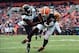 Dec 1, 2013; Cleveland, OH, USA; Cleveland Browns tight end Jordan Cameron (84) catches a pass while being defended by Jacksonville Jaguars strong safety Johnathan Cyprien (37) in the second quarter at FirstEnergy Stadium. Mandatory Credit: Andrew Weber-U