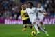 MADRID, SPAIN - OCTOBER 30: Marcelo of Real Madrid CF (R) competes for the ball with Diogo Figueiras (L) of Sevilla FC during the La Liga match between Real Madrid CF and Sevilla FC at Estadio Santiago Bernabeu on October 30, 2013 in Madrid, Spain. (Phot