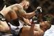 Aug 17, 2013; Boston, MA, USA; Travis Browne (top) battles Alistair Overeem during a UFC heavyweight match at the TD Garden. Brown won by knockout in one round. Mandatory Credit: Winslow Townson-USA TODAY Sports