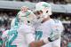 Dec 1, 2013; East Rutherford, NJ, USA; Miami Dolphins wide receiver Brian Hartline (82) and quarterback Ryan Tannehill (17) celebrate after scoring a touchdown against the New York Jets during the third quarter of a game at MetLife Stadium. The Dolphins d