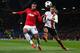 MANCHESTER, ENGLAND - DECEMBER 10: Robin van Persie of Manchester United competes with Darijo Srna of Shakhtar Donetsk during the UEFA Champions League Group A match between Manchester United and Shakhtar Donetsk at Old Trafford on December 10, 2013 in M