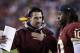 Dec 1, 2013; Landover, MD, USA; Washington Redskins offensive coordinator Kyle Shanahan talks with Redskins quarterback Robert Griffin III (10) on the sidelines against the New York Giants in the second quarter at FedEx Field. Mandatory Credit: Geoff Bur