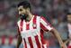 ATHENS, GREECE - SEPTEMBER 17: Dimitris Siovas of Olympiacos FC in action during the UEFA Champions League group stage match between Olympiacos FC and Paris Saint-Germain FC held on September 17, 2013 at the Georgios Karaiskakis Stadium in Athens, Greece