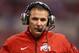 INDIANAPOLIS, IN - DECEMBER 07: Head coach Urban Meyer of the Ohio State Buckeyes calls plays from the sidelines during the Big Ten Conference Championship game against the Michigan State Spartans at Lucas Oil Stadium on December 7, 2013 in Indianapolis,