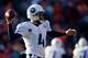 DENVER, CO - DECEMBER 8: Quarterback Ryan Fitzpatrick #4 of the Tennessee Titans throws a pass against the Denver Broncos at Sports Authority Field Field at Mile High on December 8, 2013 in Denver, Colorado. (Photo by Justin Edmonds/Getty Images)