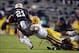 Ferguson tackles Heisman finalist running back Tre Mason.