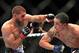 Aug 28, 2013; Indianapolis, IN, USA; Court McGee (left) fights Robert Whittaker during a UFC match at Bankers Life Fieldhouse. Mandatory Credit: Pat Lovell-USA TODAY Sports