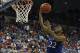 Dec 10, 2013; Gainesville, FL, USA; Kansas Jayhawks guard Andrew Wiggins (22) shoots as he gets fouled by Florida Gators forward Will Yeguete (15) during the second half at Stephen C. O'Connell Center. Florida Gators defeated the Kansas Jayhawks 67-61. Ma
