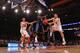 T.J. McConnell attempts to pass to big man Kaleb Tarczewski in the preseason NIT final at Madison Square Garden.