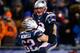 FOXBORO, MA - DECEMBER 08: Tom Brady #12 celebrates with teammate Ryan Wendell #62 of the New England Patriots following a touchdown late in the fourth quarter against the Cleveland Browns during the game at Gillette Stadium on December 8, 2013 in Foxbor